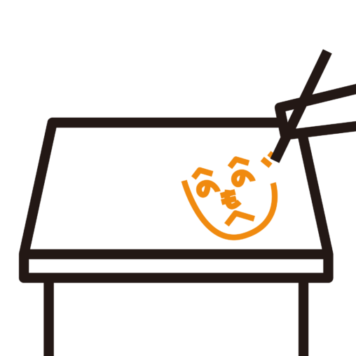 机に落書きを描く