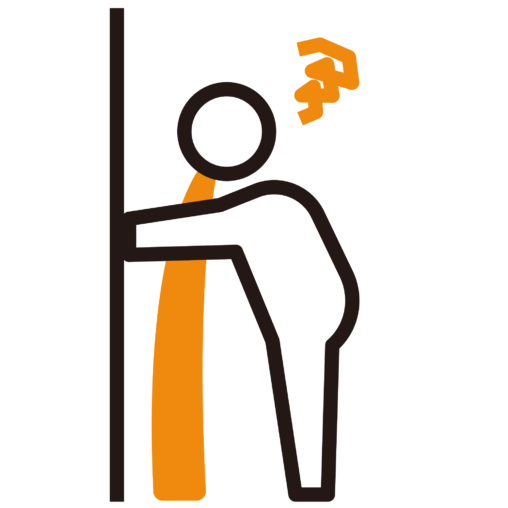 壁にもたれて吐く